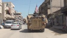 File:US armoured vehicles pass through Qamishli.ogv