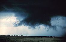 A rotating wall cloud with rear flank downdraft clear slot evident to its left rear Wall cloud12 - NOAA.jpg