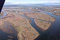 An east-facing aerial view of Ladner, British Columbia beyond Duck Island, Barber Island, Gunn Island and Port Guichon in the Fraser River Estuary