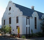 High saddle roofed hall with Cape Dutch Revival concavo convex gable with moulding, plaster pilaster Current use: Civic : Museum. Intrinsic aesthetic/architectural merit