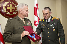 Commandant of the U.S. Marine Corps, Gen. James F. Amos receives an award at Tbilisi, Georgia, Sept. 4, 2014..JPG