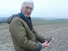 Bangs having just found a Neolithic axe head on the Brighton Downs, January 2021.