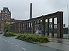 Restant van de muur van de voormalige weverij van de firma Gerhard Jannink & Zonen. De muur kan gezien worden als een 'aanloop' tot het meer naar de stad gelegen Janninkcomplex, waar het vroeger deel van uitmaakte.