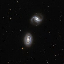 Figure 7: Tidal force is responsible for the merge of galactic pair MRK 1034. Inseparable galactic twins.jpg