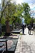 North alley of the 2nd Christian Cementery in Odessa. View from Tombstone on the tomb of Boris Derevyanko, journalist and editor of Odessa city newspaper "Вечерняя Одесса", to the curch