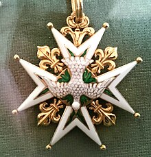 ornate star used as jewelry or decoration on clothing