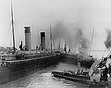 S.S. New York breaking free of her moorings in Southampton. RMS Oceanic is to her left. Titanic avoiding collision in Southampton.jpg