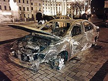 A charred civilian vehicle from Mariupol after the attack. Exhibition in Kyiv. Naslidki rosiis'kogo obstrilu Mariupolia.jpg