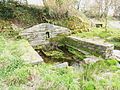 La fontaine Saint-Jean au Mougau (restaurée par l'association « Lichen »).