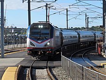 A typical Northeast Regional with an ACS-64 locomotive and Amfleet I passenger cars at New London Union Station Amtrak 606 entering New London Union Station, September 2014.JPG