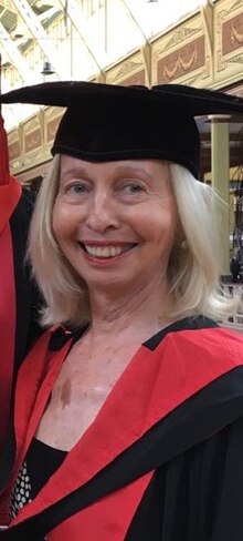 Photograph of Collette Tayler in academic dress
