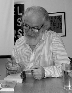 English: David Crystal signing a book at the H...