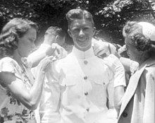 Carter with Rosalynn Smith and his mother at his graduation from the United States Naval Academy in Annapolis, Maryland, June 5, 1946 Graduation of Jimmy Carter from U.S. Naval Academy, Annapolis, Maryland, Rosalynn Carter and Lillian Carter Pinning on Ensign Bars - DPLA - e1b1f2b5b4e38fc82cfe091678fc112a.jpg