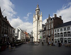 Town hall of Halle, with the statue of cellist and composer Adrien-François Servais in front.