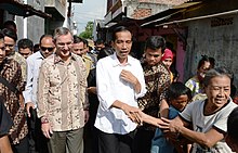 Jokowi doing blusukan in 2013, with US ambassador Scot Marciel Joko Widodo 2013.jpg