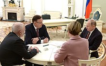 Putin with co-chairs of his headquarters Putin, Kogogin, Rumyantsev and Shmelyova.jpg