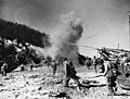 The People's Volunteer Army disembarks on a western Korean island under the cover of artillery and machine guns, c. 1951