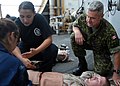 Capt. Rory MacDonald, Canadian Forces chaplain, comforts a simulated victim.