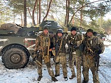 Ukrainian soldiers with a captured Russian BRDM in March 2022 Vehicle recaptured by Ukrainian forces in Luhansk Oblast, 12 March 2022 (01).jpg