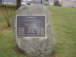 bronze plaque listing the people's names who died during the disaster (with the exception of the Kehoes), fixed to a large boulder