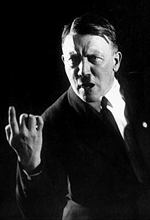 Adolf Hitler in 1927, rehearsing his oratorical gestures; photo by Heinrich Hoffmann, Bundesarchiv. Bundesarchiv Bild 102-13774, Adolf Hitler.jpg