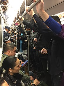 The interior of a Q train during afternoon rush hour Downtown Q Train Rush Hour.jpg