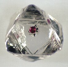 Red garnet inclusion in a diamond Garnet inclusion in diamond.jpg