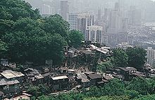 Shanty towns may be large or small settlements. Above a shanty town in Hong Kong. Shanty housing in Hong Kong.jpeg
