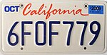 A California license plate with blue text on white background. On the top reads “California” in red.