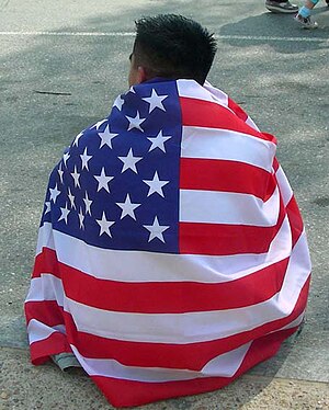 Protester at March for America wears an Americ...