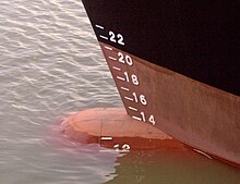 The more heavily loaded a ship is, the lower it sits in the water. Maximum DWT is the amount of weight a ship can carry without riding dangerously low in the water. Draft scale at the ship bow (PIC00110).jpg