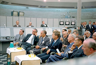 Kennedy attending a briefing at Cape Canaveral on September 11, 1962. With him in the front row are (from left) NASA administrator James Webb, Vice President Lyndon Johnson, NASA Launch Center director Kurt Debus, Lieutenant General Leighton I. Davis and Secretary of Defense Robert McNamara. JFK Tour of KSC - GPN-2000-000605.jpg