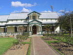 The site with the historic old Coetzenburg farmstead (now known as the Stellenbosch Jannie Marais House), the cellar and outbuildings thereon, together with that portion of land north of the house and extending to the banks of the Eerste River.