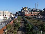 In March 2011 the unused trackbed has been cleared but vegetation has a greater hold on the platform