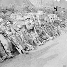 Members of the Black Watch in combat uniforms relaxing during the Korean War 1st Battalion, The Black Watch - Hook, Korea.jpg