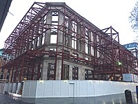 The facade of 48 Leicester Square stands alone in January 2015, after demolition of the building behind it. Originally Fanum House, designed by Andrew Mather and built in three phases 1923-26, 1936–37 and 1956–59
