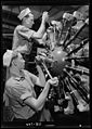 Aviation machinists mates working on an aircraft engine
