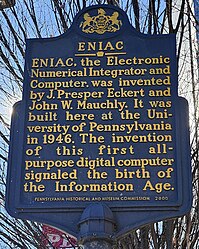 A Pennsylvania state historical marker in Philadelphia cites the creation of ENIAC, the "first all-purpose digital computer", in 1946 as the beginning of the Information Age. ENIAC Pennsylvania state historical marker.jpg