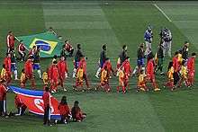 The Brazilian and North Korean teams before their group stage match FIFA World Cup 2010 Brazil North Korea 3.jpg