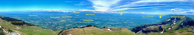 View from Reculet mountain towards Geneva. The canton occupies most of the Geneva basin, the valley between the Reculet (France) and Mount Saleve (France). The Alps are visible in the background, covered by clouds Genevan basin from Reculet.jpg