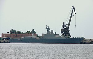 A grey ship at dock