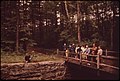 Inspectors from DOCUMERICA looking at the granite walls of the Nashua River power canal in June 1973