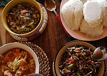 Nsima (top right corner) with three types of relish. Nsima Relishes.JPG