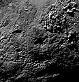 Plutón, posible criovolcán Wright Mons, mostrando su depresión central