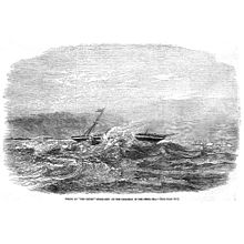 A black and white image showing a shipwreck in rough seas