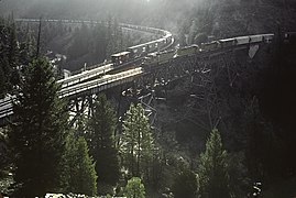 Westbound train waits for northbound train to clear Tunnel 31 (Mar 1983)