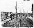 Railwaymen to work after a flooding of the Saint-Pierre River at west of the road to Saint-Paul-Coast in 1906