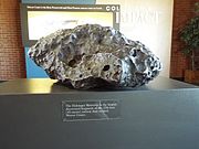 The Holsinger Meteorite is the largest fragment of the meteorite that created Meteor Crater. It is on exhibit in the crater Meteor Crater visitor center. The Meteor Crater Visitor Center is located on exit 233 off Interstate 40 in Winslow, Arizona.