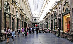 The Royal Saint-Hubert Galleries shopping arcade in Brussels, Belgium. Consumer behaviour, in its broadest sense, is concerned with how consumers select, decide and use goods and services. (Belgium) Galeries Royales St Hurbert, Brussels.jpg