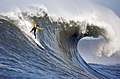 Image 10A man engaging in big wave surfing at Mavericks, located just north of Half Moon Bay, California. Big wave surfing is a discipline within surfing in which experienced surfers paddle into or are towed onto waves which are at least 20 ft (6.1 m) high, and is a hazardous activity, as surfers can be pushed far beneath the surface of the water after a wipeout.